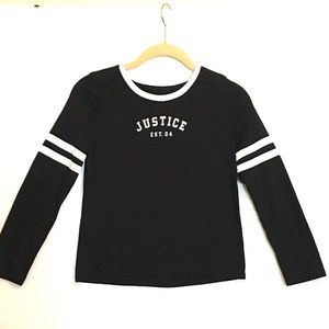 Justice black shirt with white neck and sleeve trim. Long sleeves Size 10